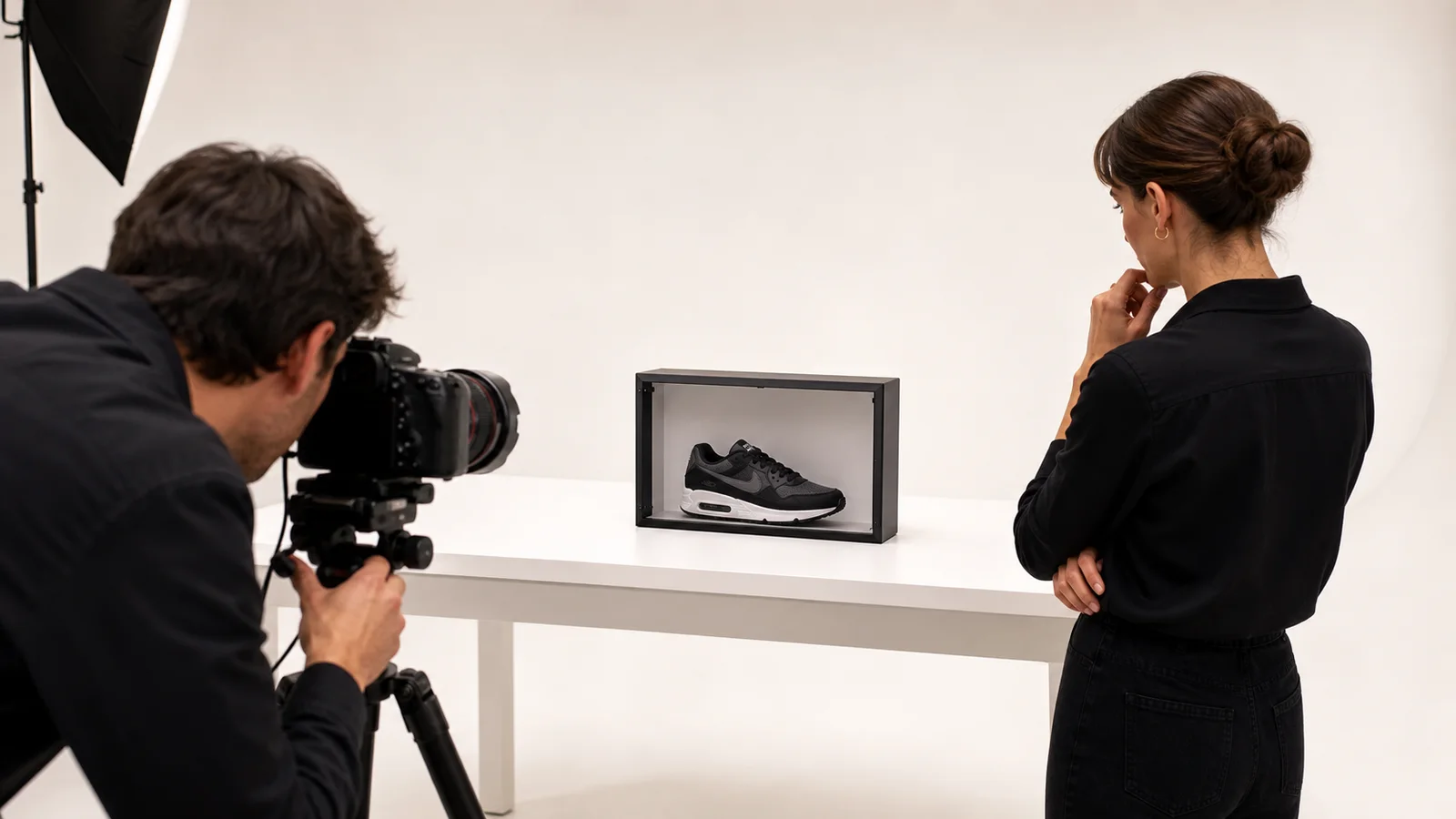 Creative team photographing a dimensional sneaker twin inside a 15-inch optical product stage